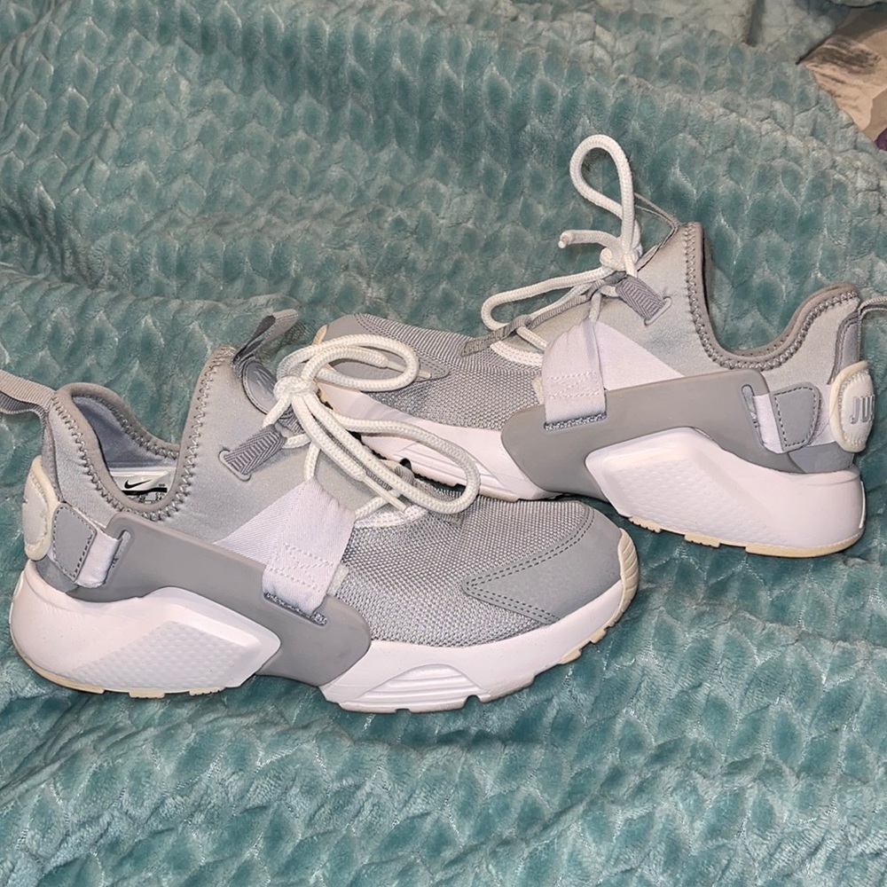 Gray and white Nike Air Huarache.